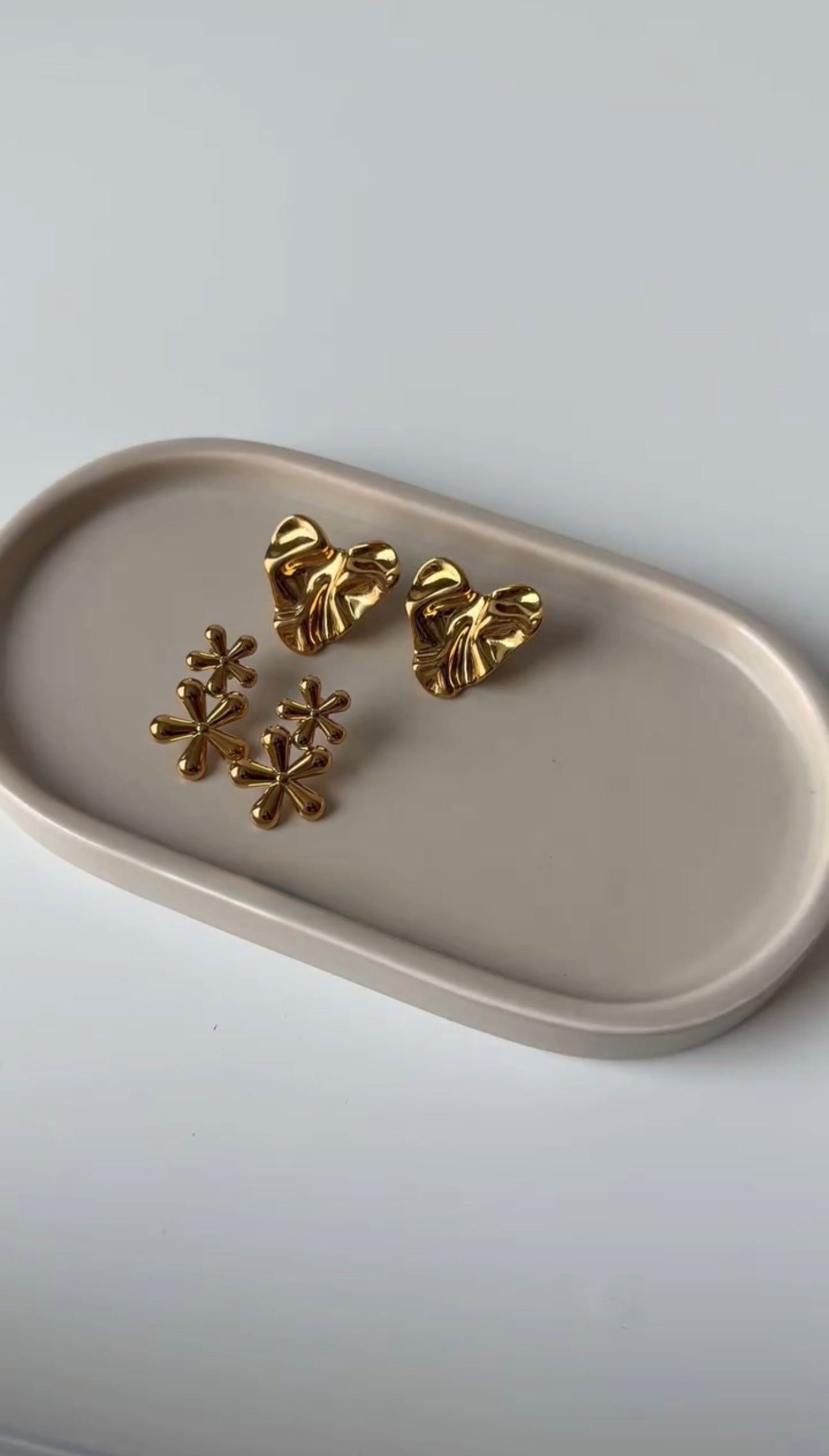 Three pairs gold platted earrings