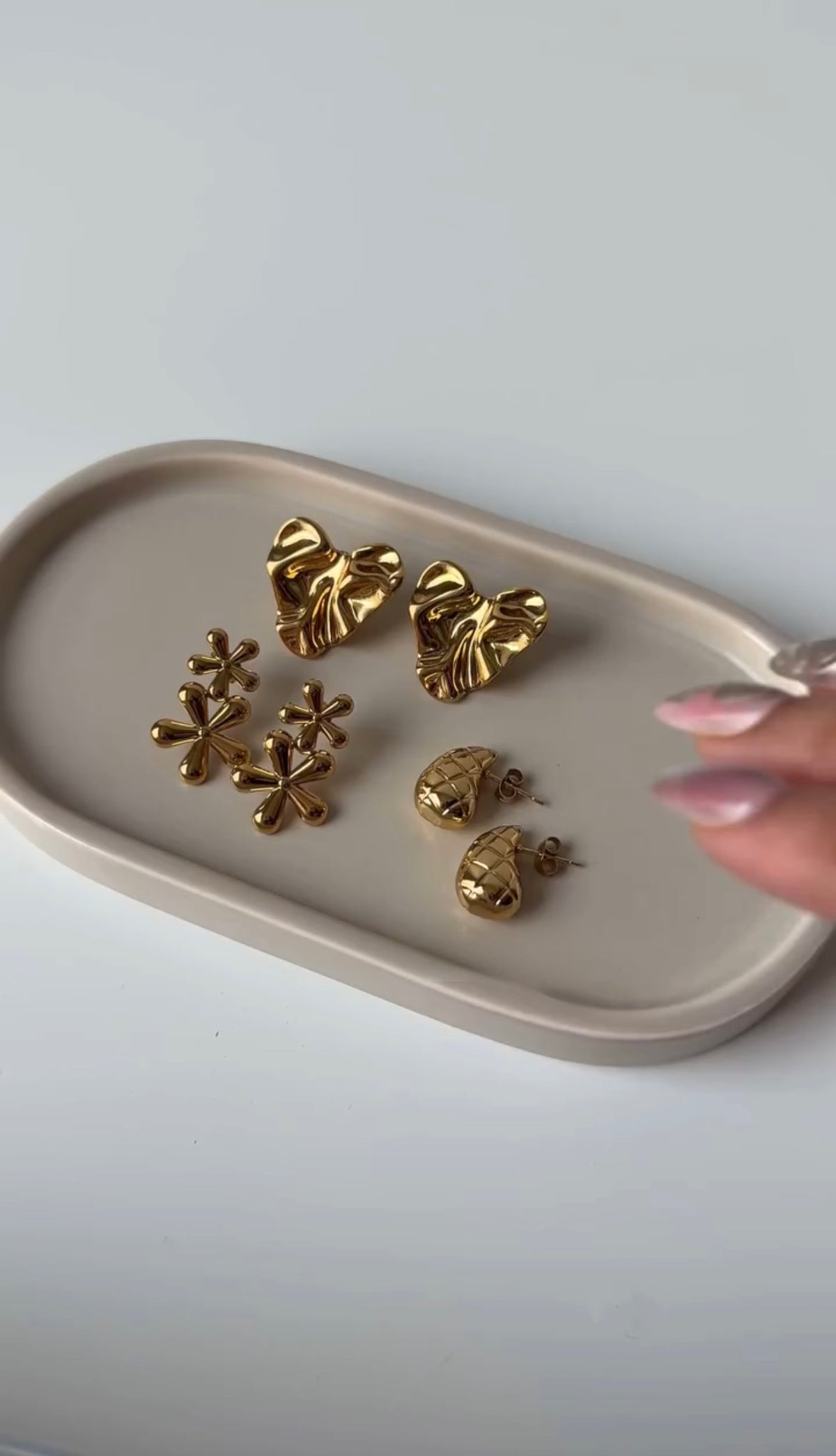 Three pairs gold platted earrings