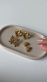 Three pairs gold platted earrings